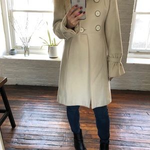 Mid length off white coat
